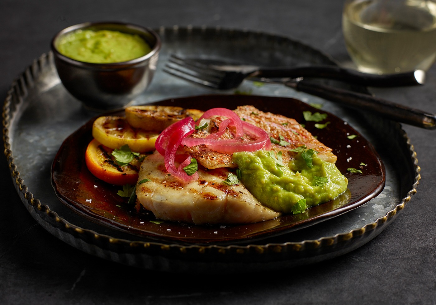 GRILLED RED SNAPPER WITH AVOCADO & TOMATILLO SALSA on plate