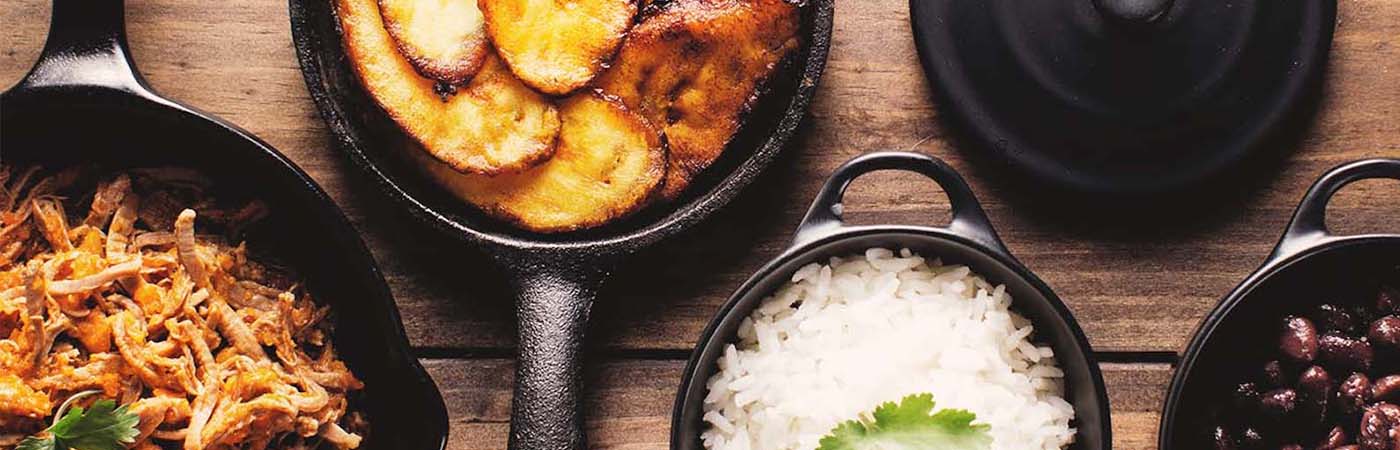 Overhead shot of latin foods in skillets