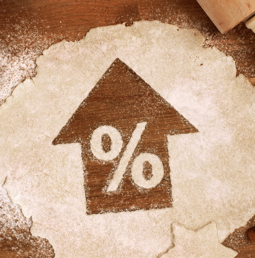 Symbol of percent going up cut into dough