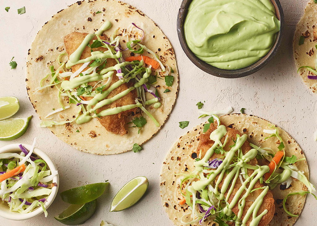 Wholly beer battered fish tacos with avocado crema