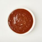 DOÑA MARIA® mole rojo in a ramekin