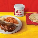 DOÑA MARIA® mole rojo on a dinner table