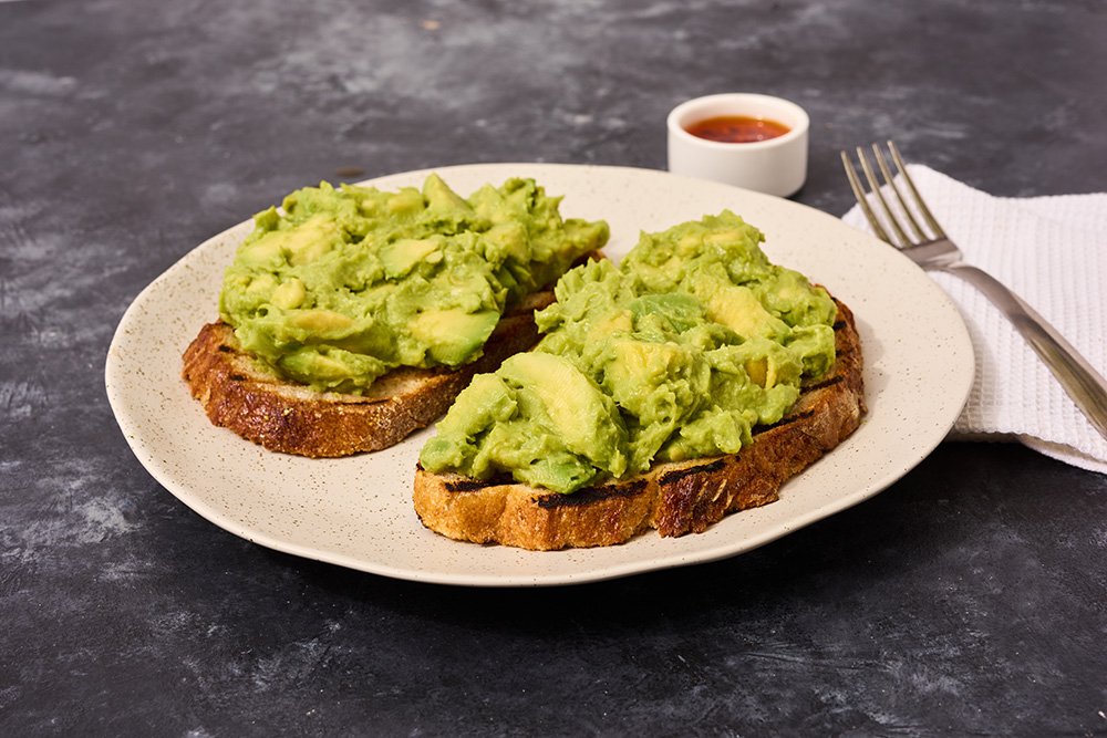 Two slices of avocado toast on a plate